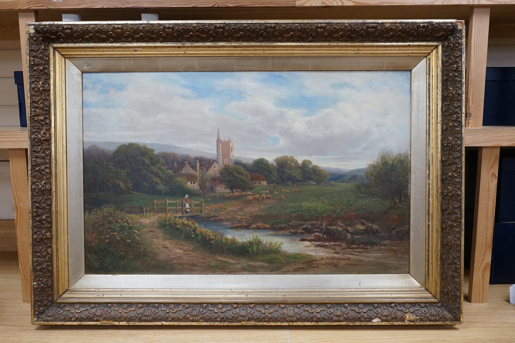 19th century, English School, Rural landscape with stream before a village, unsigned, oil on canvas, 50 x 80cm
